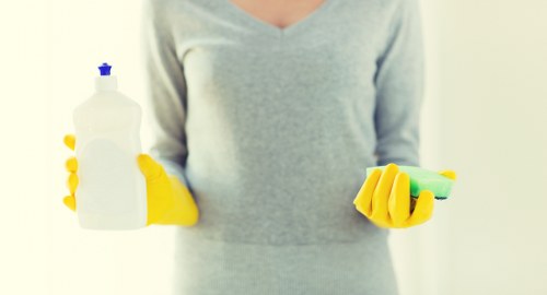 Preparing for safe oven cleaning with gloves and cloths